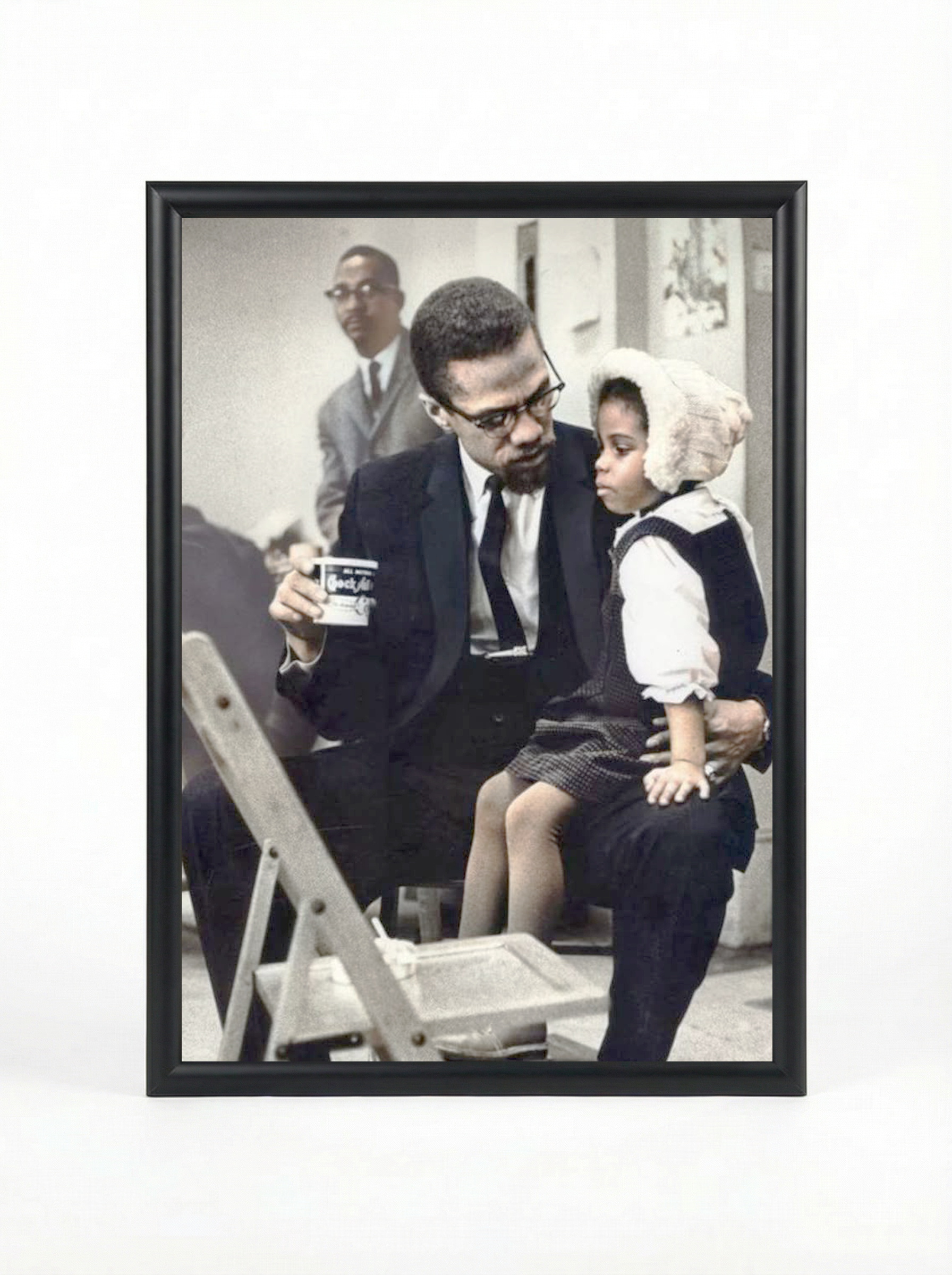 Malcolm X with Daughter: Tender Moment