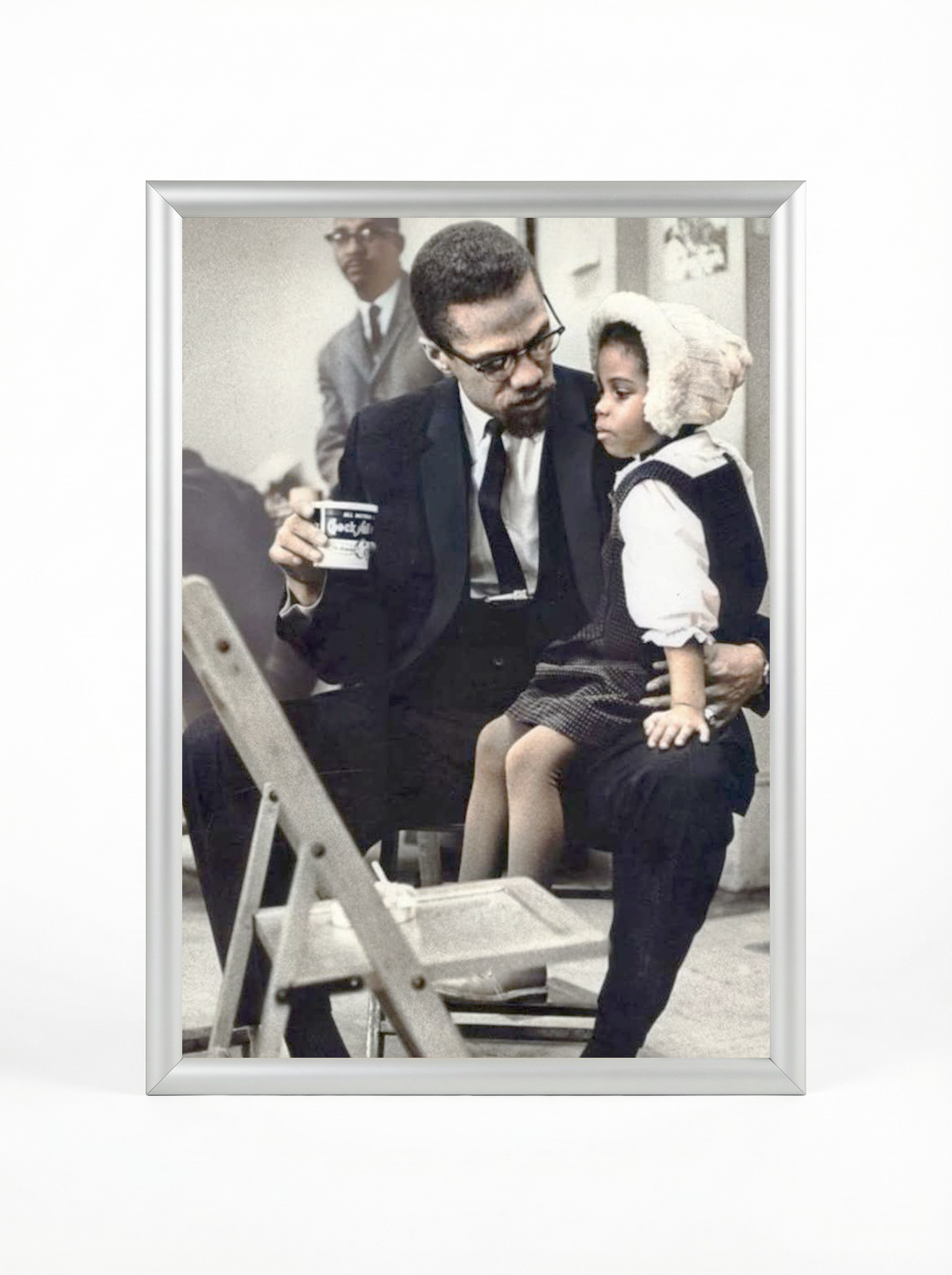 Malcolm X with Daughter: Tender Moment